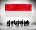 Silhouettes of Business People Looking at the Indonesian Flag