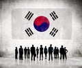 Silhouettes of Business People Looking at the South Korean Flag