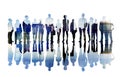 Silhouettes of Business People Overlayed with Cityscape Royalty Free Stock Photo