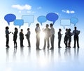 Silhouettes of Business People and Speech Bubbles Royalty Free Stock Photo