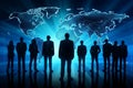 Silhouettes of business people standing in front of digital world map Royalty Free Stock Photo