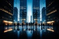 silhouettes of business people walking in a city at night Royalty Free Stock Photo