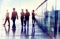 Silhouettes of Business People Walking in the Office Royalty Free Stock Photo
