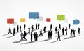 Silhouettes of Business People Working and Speech Bubbles Above Royalty Free Stock Photo