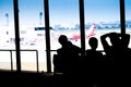 Silhouettes of businessman and passengers traveling on airport, Royalty Free Stock Photo