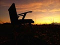 Silhouettes of chairs in the outer courtyard with the sunrise in the background. For relaxation and meditation