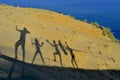 Silhouettes of cheerful happy family enjoying Royalty Free Stock Photo