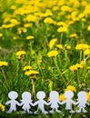 Silhouettes of children holding hands cut out of cardboard International children`s day. Copy space