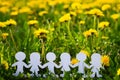 Silhouettes of children holding hands cut out of cardboard International children`s day. Copy space