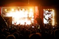 Silhouettes of concert crowd in front of bright stage lights Royalty Free Stock Photo