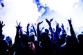 Silhouettes of concert crowd in front of bright stage lights with confetti Royalty Free Stock Photo