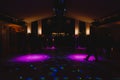 Silhouettes of concert crowd in front of bright stage lights. Disco and nightlife concept Royalty Free Stock Photo