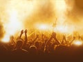 Silhouettes of concert crowd in front of bright stage lights. Royalty Free Stock Photo