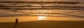 Silhouettes of a couple enjoying the sunset on the atlantic ocean Lacanau France