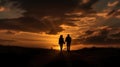 silhouettes couple holding hands at sunset