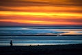 Silhouettes of couple hug enjoy sunset in beach together. Concepts of connections togetherness and freedom joy of life together.