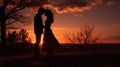 Silhouettes of a couple in love at sunset. As the sun sets on Valentine's Day, couples are silhouetted hugging