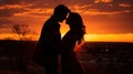 Silhouettes of a couple in love at sunset. As the sun sets on Valentine& x27;s Day, couples are silhouetted hugging