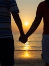 Silhouettes couples holding hands