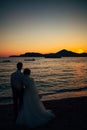 Silhouettes of couples near Sveti Stefan