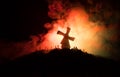 Silhouettes crowd of hungry zombies and old windmill on hill against dark foggy toned sky. Silhouettes of scary zombies walking at Royalty Free Stock Photo