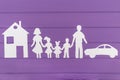 The silhouettes cut out of paper of man and woman with two girls and boy house and car near Royalty Free Stock Photo