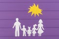 The silhouettes cut out of paper of man and woman with two girls and boy under the sun Royalty Free Stock Photo