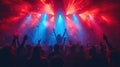 Silhouettes of dancing people in front of bright stage lights during a concert Royalty Free Stock Photo