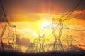 Silhouettes of electricity transmission pole in sunset Royalty Free Stock Photo