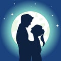 Silhouettes of embracing men and women against the backdrop of the moon. Two silhouettes of a man and a woman embracing against th Royalty Free Stock Photo