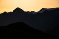 Silhouettes of the Fagaras Mountains at sunrise. The Mount Tarata