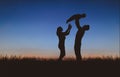 Silhouettes of family at sunset