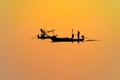 silhouettes fishermen in boat Royalty Free Stock Photo