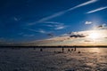 Silhouettes of fishermen fishing and ice screws in winter Royalty Free Stock Photo