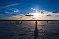 Silhouettes of fishermen fishing and ice screws in winter on the lake Royalty Free Stock Photo