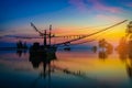 Silhouettes fishing boat and tree at sunset time Royalty Free Stock Photo