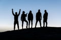Silhouettes of five young people, group of friends. Royalty Free Stock Photo