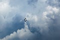 Silhouettes of four Su-30 SM, russian fighter aircrafts high in the blue cloudy sky