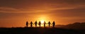 The silhouettes of friends holding hands against a stunning sunset backdrop. AI generated image Royalty Free Stock Photo