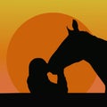 Silhouettes of a girl kissing a horse Royalty Free Stock Photo