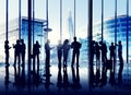 Silhouettes Of Group Of Busy Business People