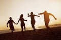 Silhouettes group friends peoples beach run sunset Royalty Free Stock Photo