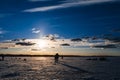 Silhouettes of a group of men fishermen on winter fishing Royalty Free Stock Photo