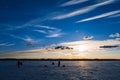 Silhouettes of a group of men fishermen on winter fishing Royalty Free Stock Photo