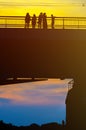 Silhouettes a Group of People on the High Bridge