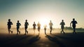 Silhouettes of a group of people running on the road Royalty Free Stock Photo