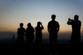 Silhouettes group of people taking pictures at sunset in Nahagarh Fort Jaipur.