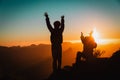 Silhouettes of happy little boy and girl hiking at sunset mountains Royalty Free Stock Photo