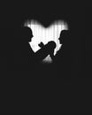 Silhouettes of happy parents, father and mother holding newborn baby by the window, heart shaped Royalty Free Stock Photo