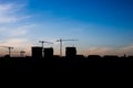 Silhouettes high-rise buildings under construction on background of the blue sky Royalty Free Stock Photo